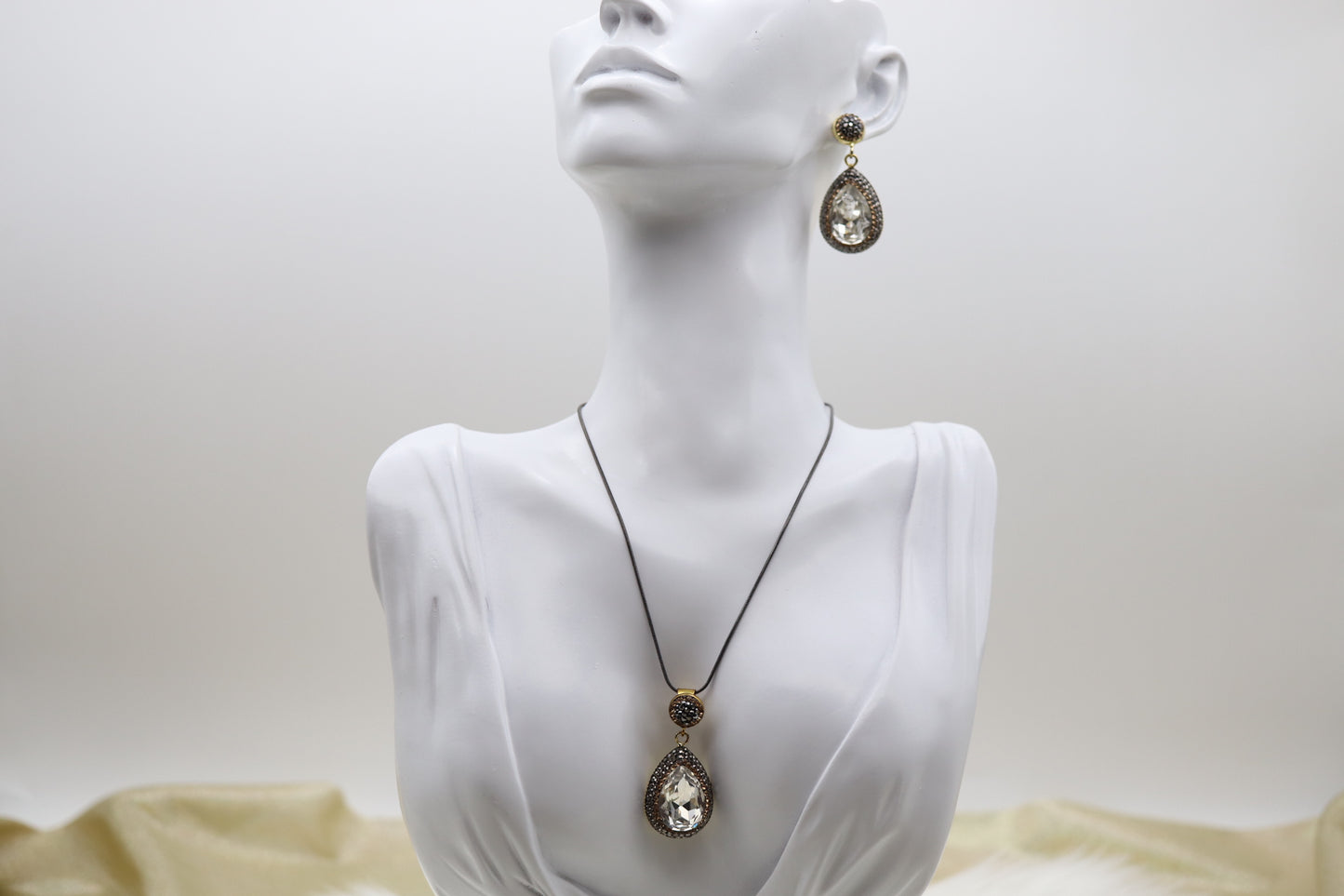 Matching Necklace and Earrings With Pear Shaped Clear Faceted CZ Stones With Gold Trim