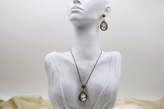 Matching Necklace and Earrings With Pear Shaped Clear Faceted CZ Stones With Gold Trim