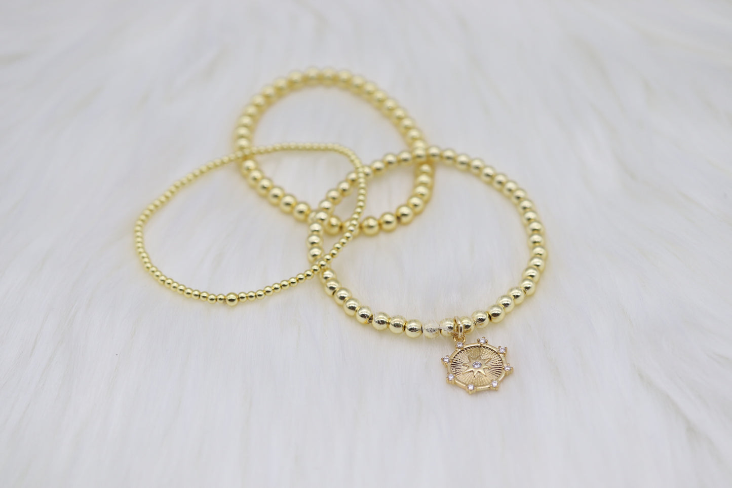 Triple Layered Gold Beaded Bracelet With Diamond Star Dangling Pendant