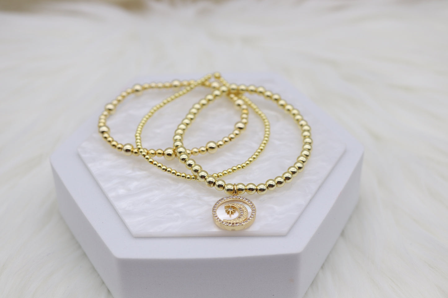 Triple Layered Gold Beaded Bracelet With Half Moon Dangling Pendant