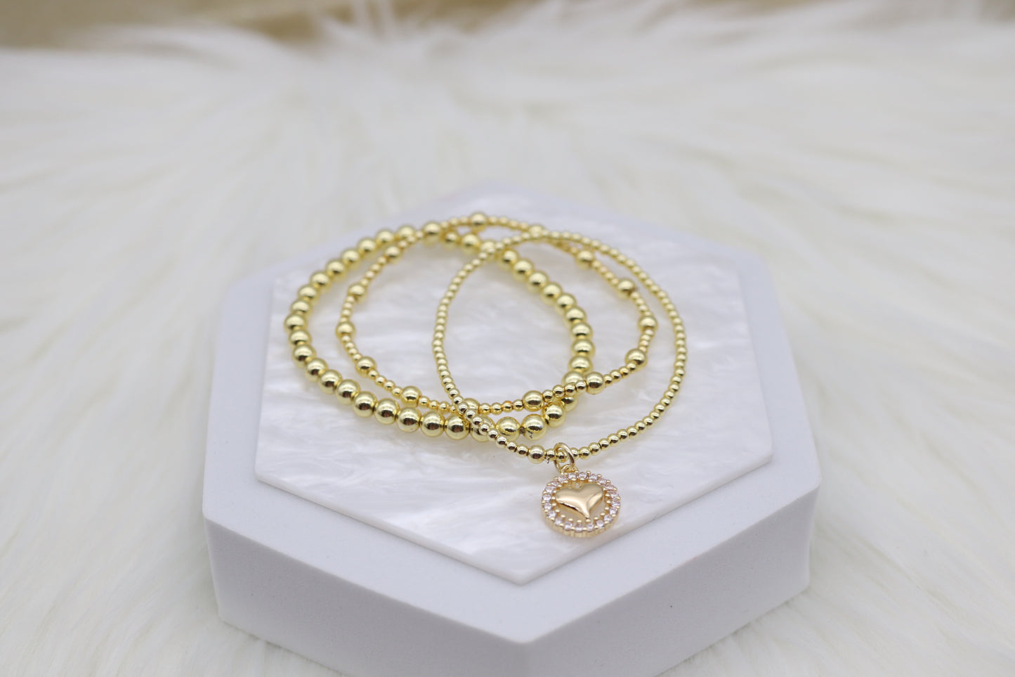 Triple Layered Gold Beaded Bracelet With Heart Dangling Pendant
