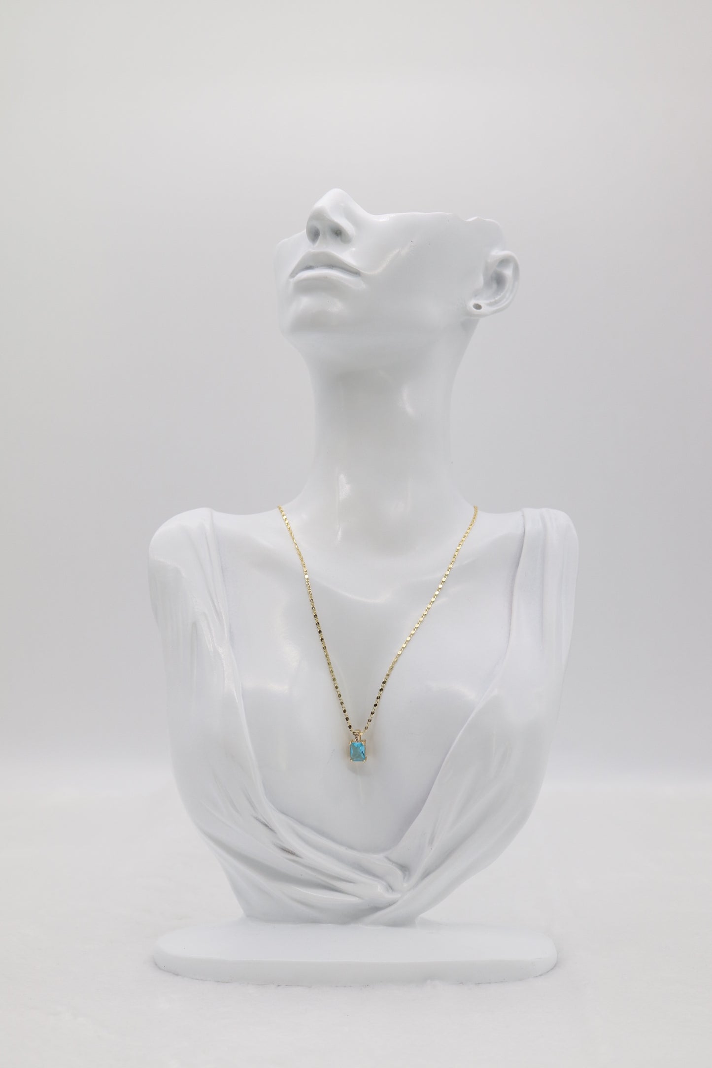 Gold Necklace with Rectangular Blue Gemstone Pendant