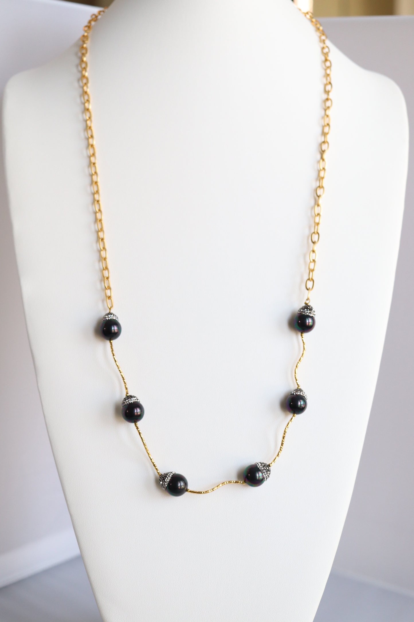 Gold Necklace and Black Beads