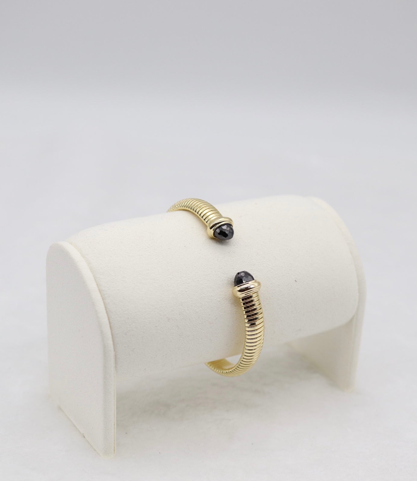 Gold Coil Cuff Bracelet with Black Gemstone Ends