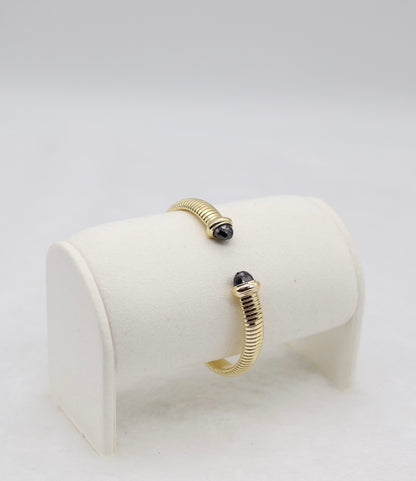 Gold Coil Cuff Bracelet with Black Gemstone Ends