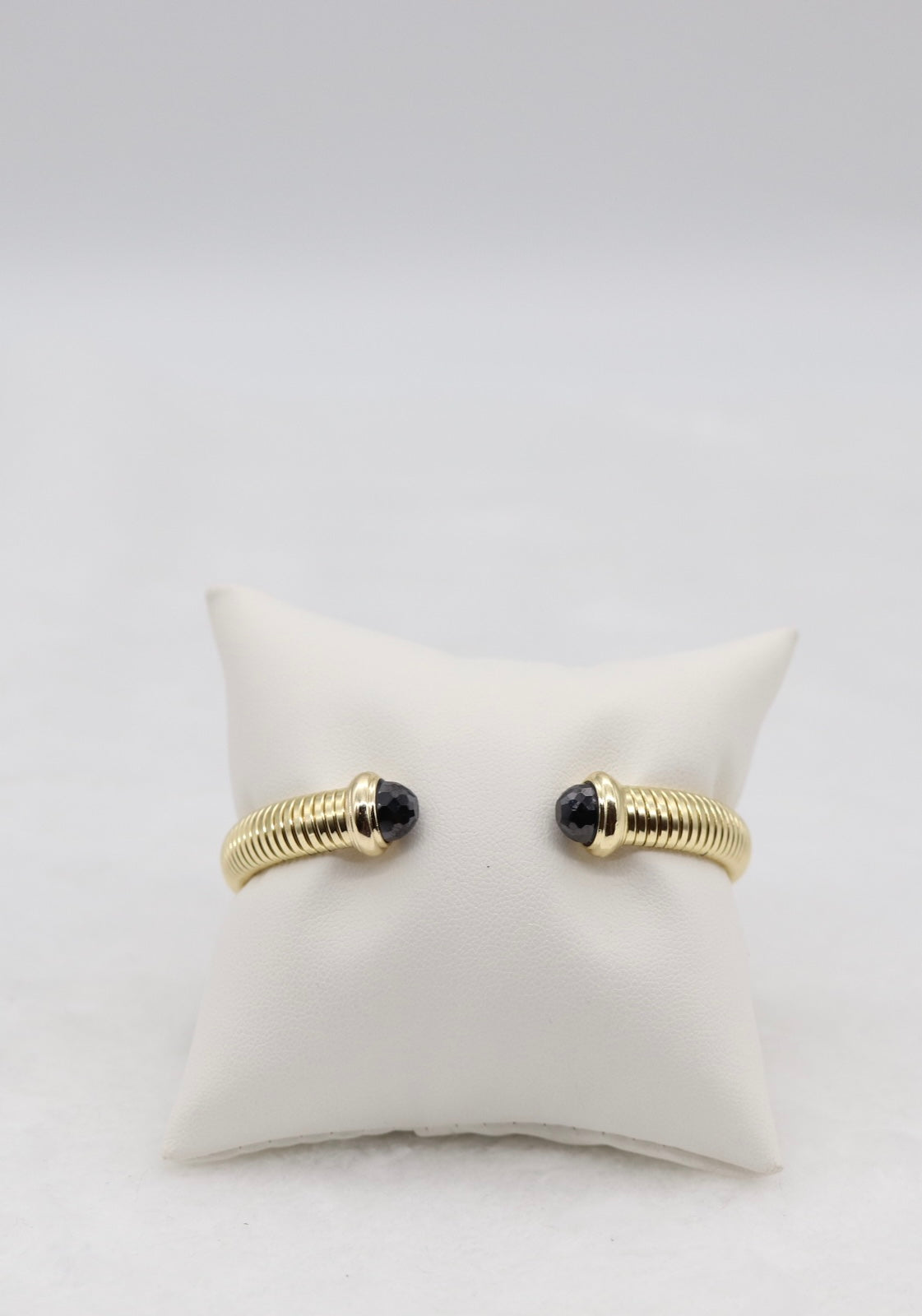 Gold Coil Cuff Bracelet with Black Gemstone Ends