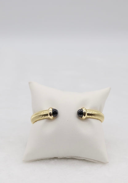 Gold Coil Cuff Bracelet with Black Gemstone Ends