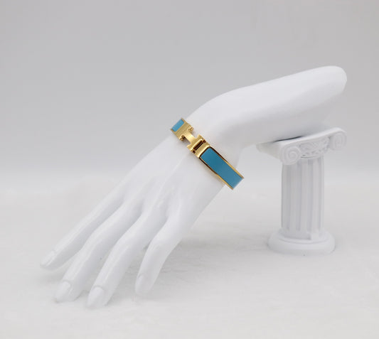 Elegant Light Blue Enamel “H” Bracelet – Gold Tone