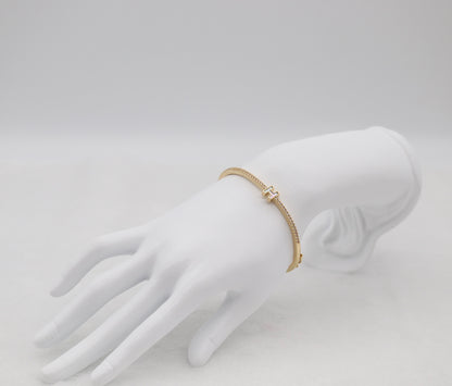 Gold-Tone Hinged Bangle with Crystal Accents and “H” Centerpiece