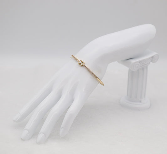 Gold-Tone Hinged Bangle with Crystal Accents and “H” Centerpiece