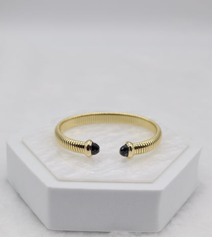 Gold Coil Cuff Bracelet with Black Gemstone Ends