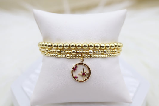 Triple Layered Gold Beaded Bracelet With Star Dangling Pendant