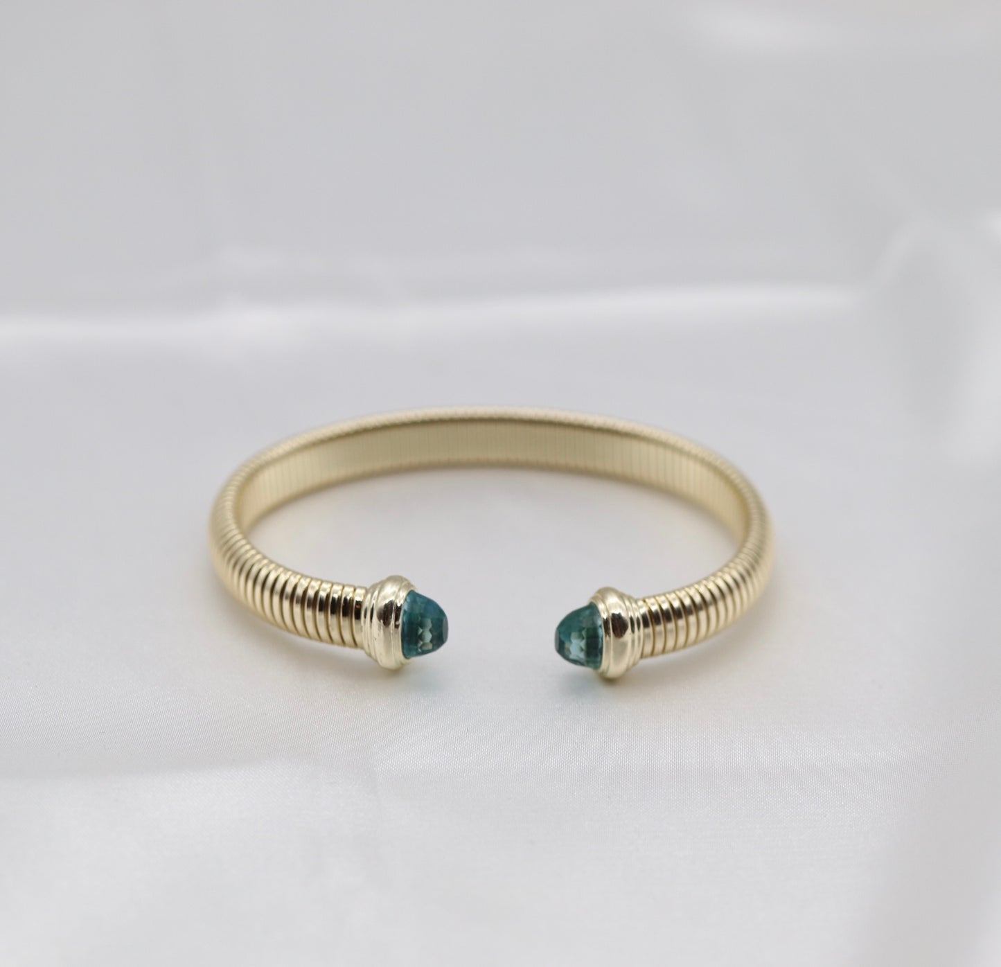 Gold Tubogas Cuff Bracelet With Light Blue Crystal Ends