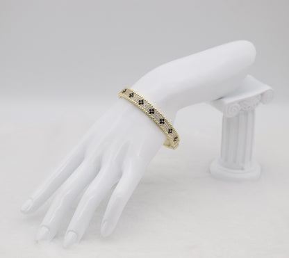 Gold-Tone Hinged Bangle with Black Floral Accents