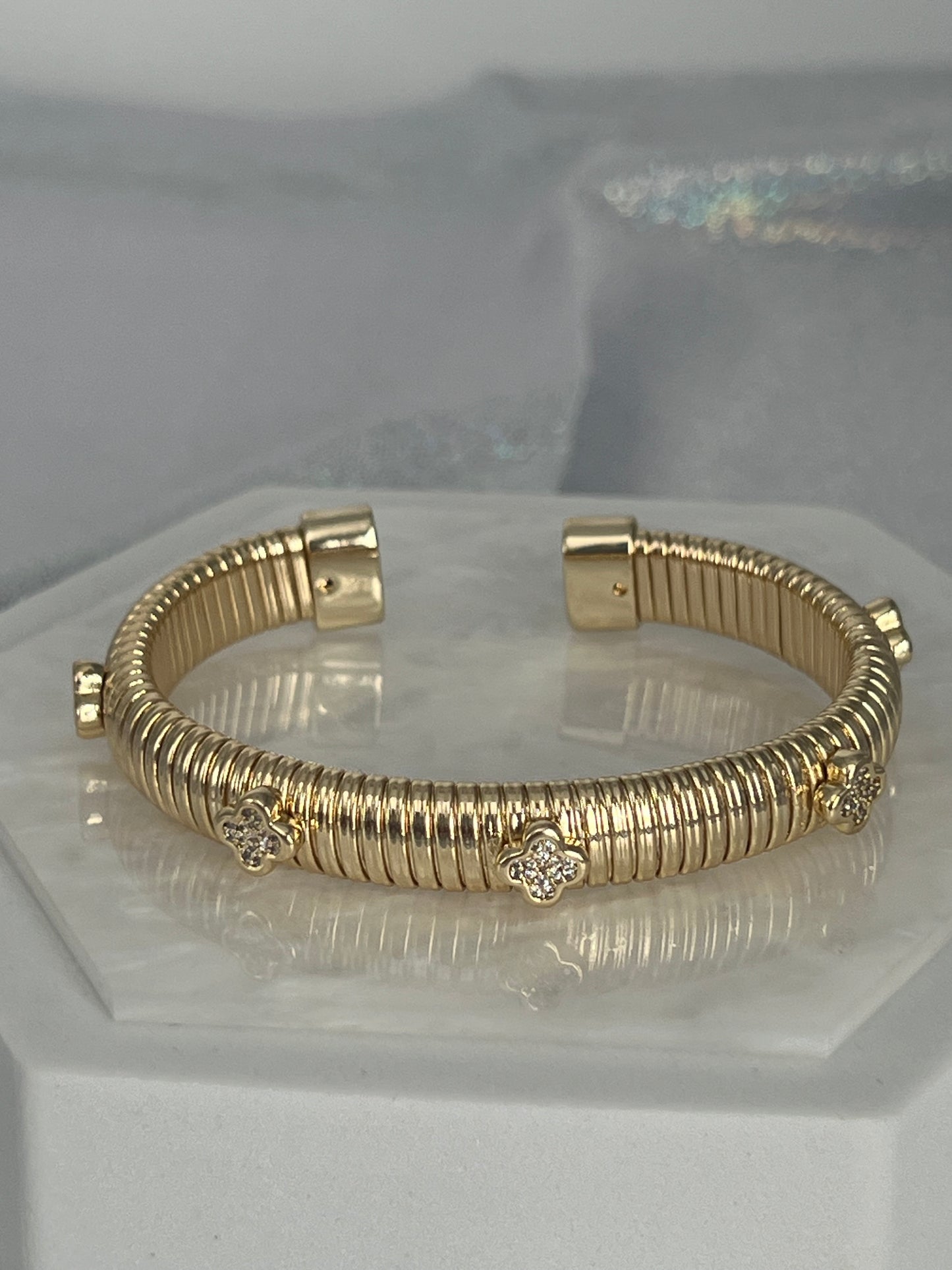 Gold Tubogas Cuff Bracelet With Four Clover Stations