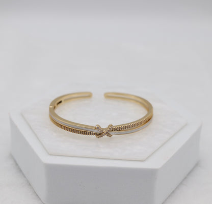 Gold-Tone Cuff Bracelet with Crystal Pavé Bow