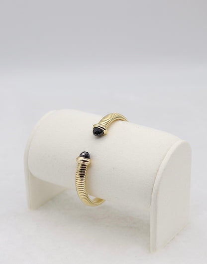 Gold Coil Cuff Bracelet with Black Gemstone Ends
