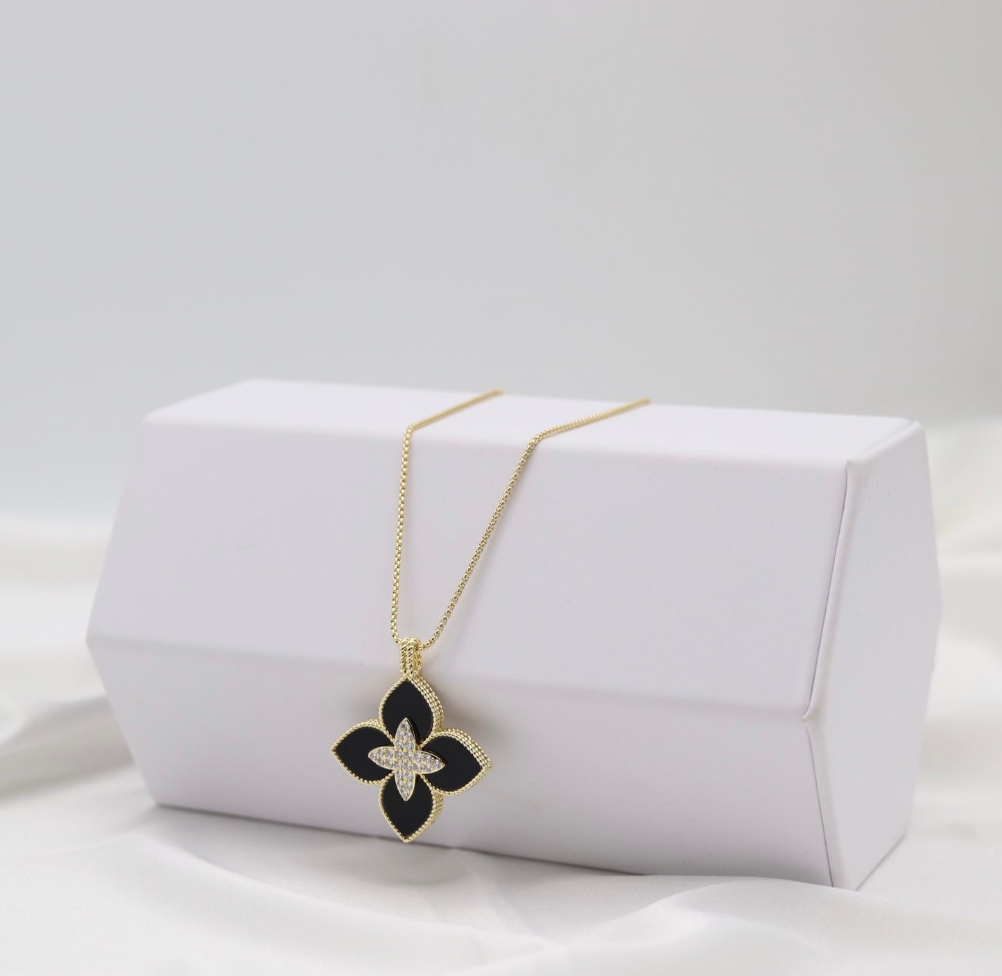 Black Clover Luxe Pendant Necklace – Gold Tone with Crystal Center