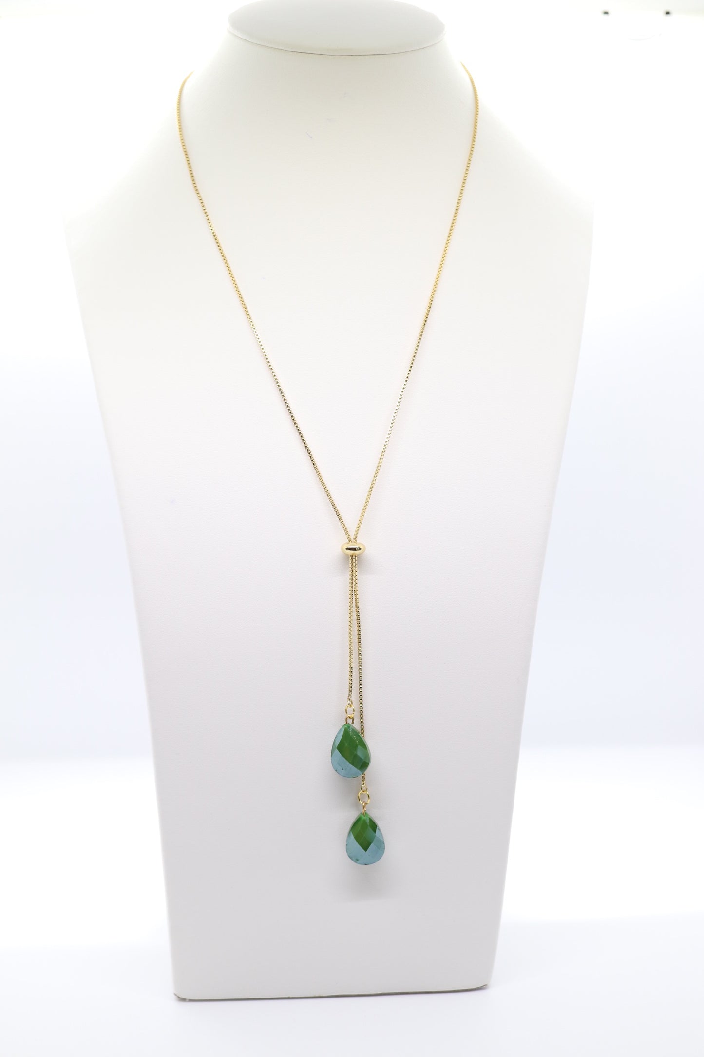 Gold Necklace With Dangling Emerald Teardrops Stones