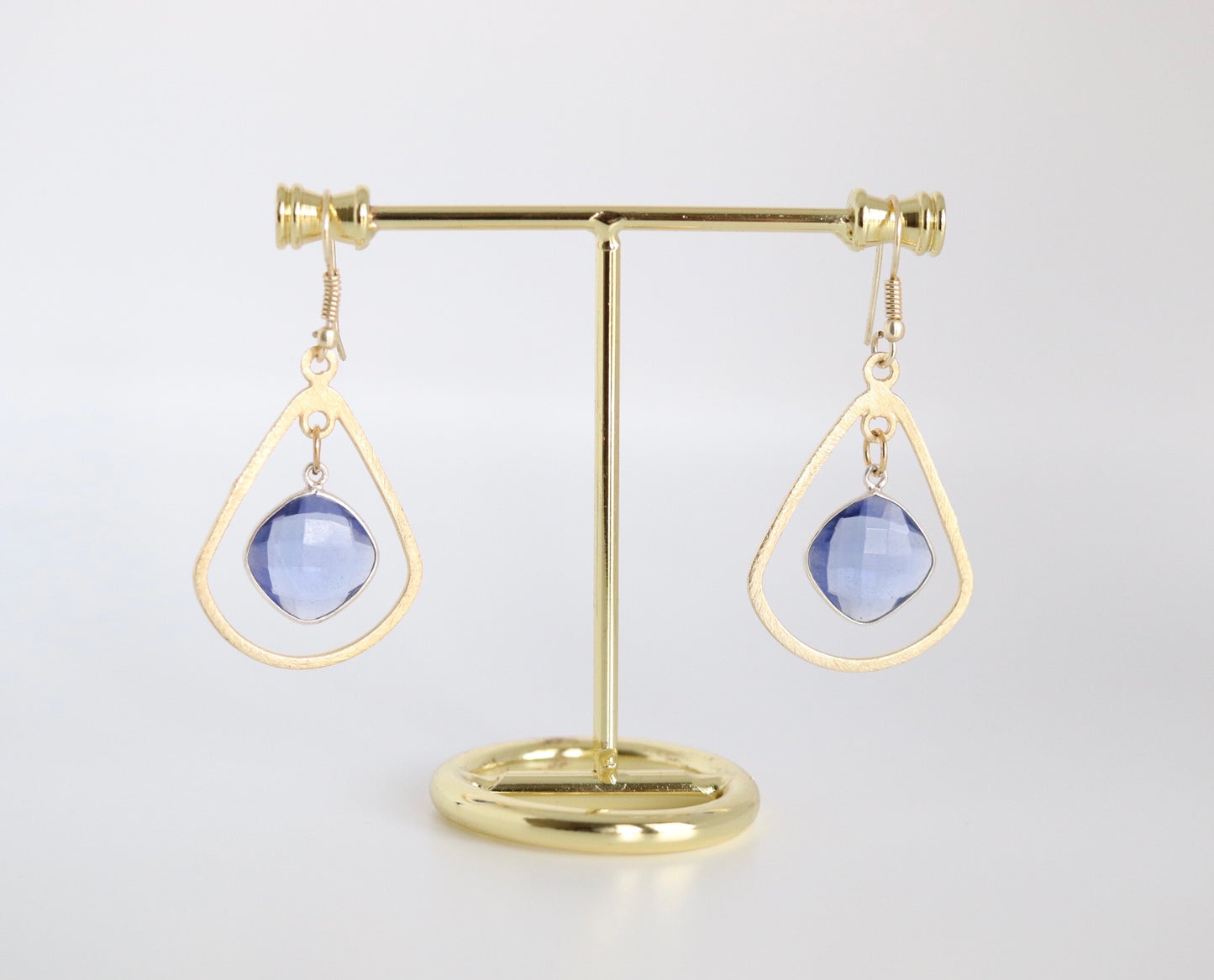 Gold Teardrop Dangling Earrings With Light Blue Stones